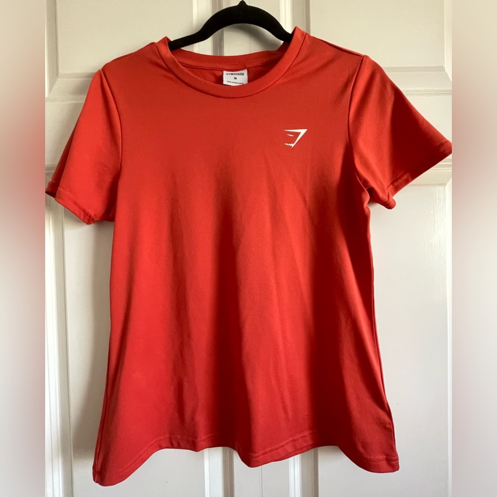 GYMSHARK short sleeve shirt, dark salmon, size medium.